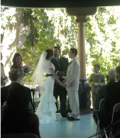 A couple exchanging vows on the Rosemount veranda